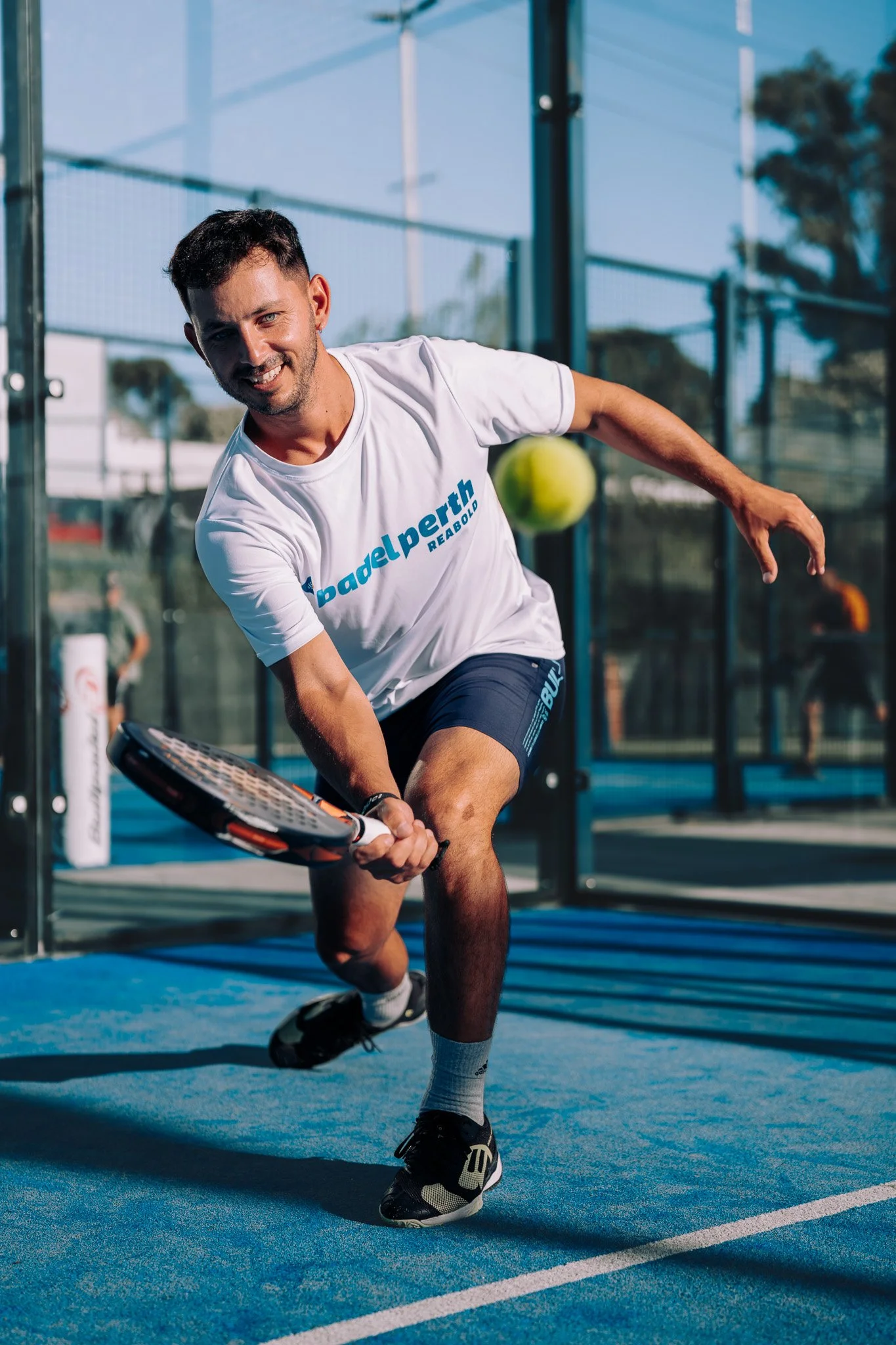 Men playing padel tennis in Perth