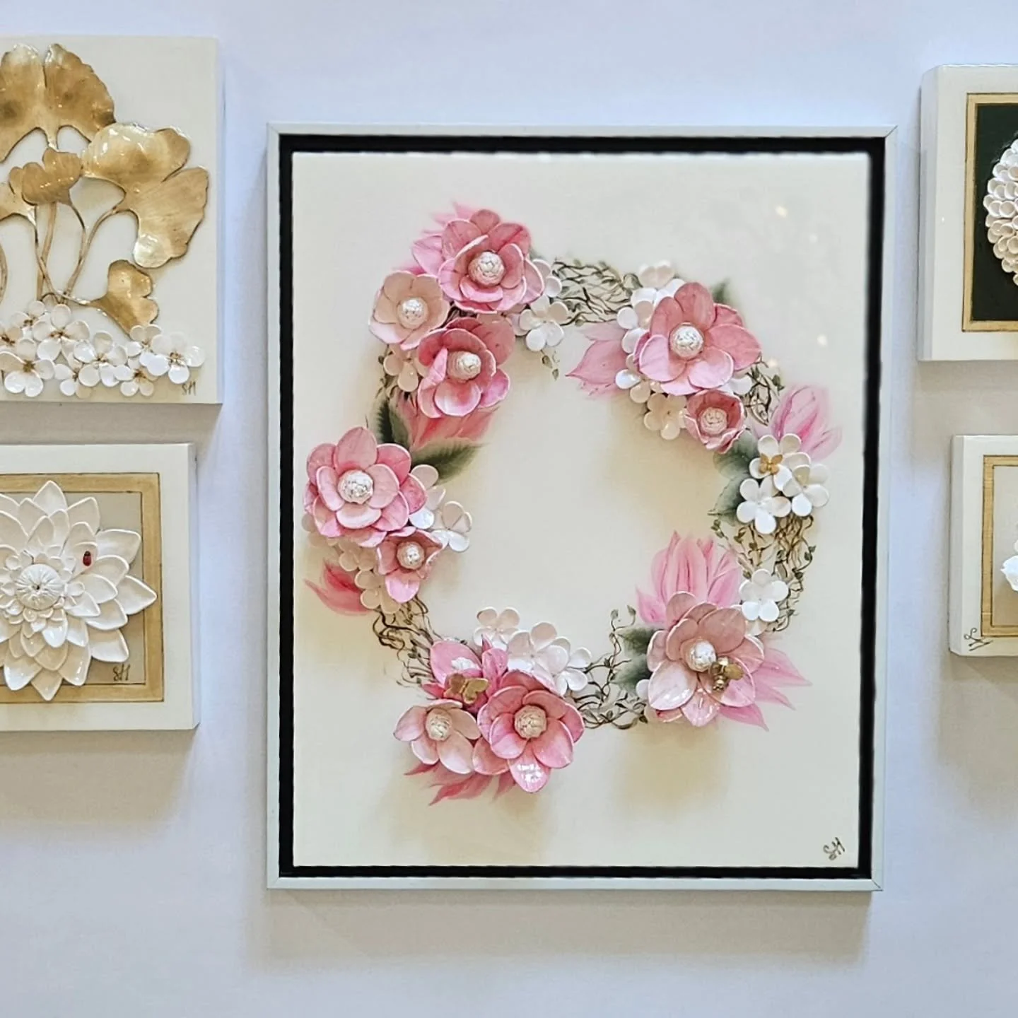 This sweet wreath was hand painted on canvas.  Magnolias and Stephanotis were added for dimension.  Butterflies landed for a a little touch of whimsy🦋. Framed in a 16&quot;x20&quot; float frame and it is ready for market launch soon.  Stay tuned. ..