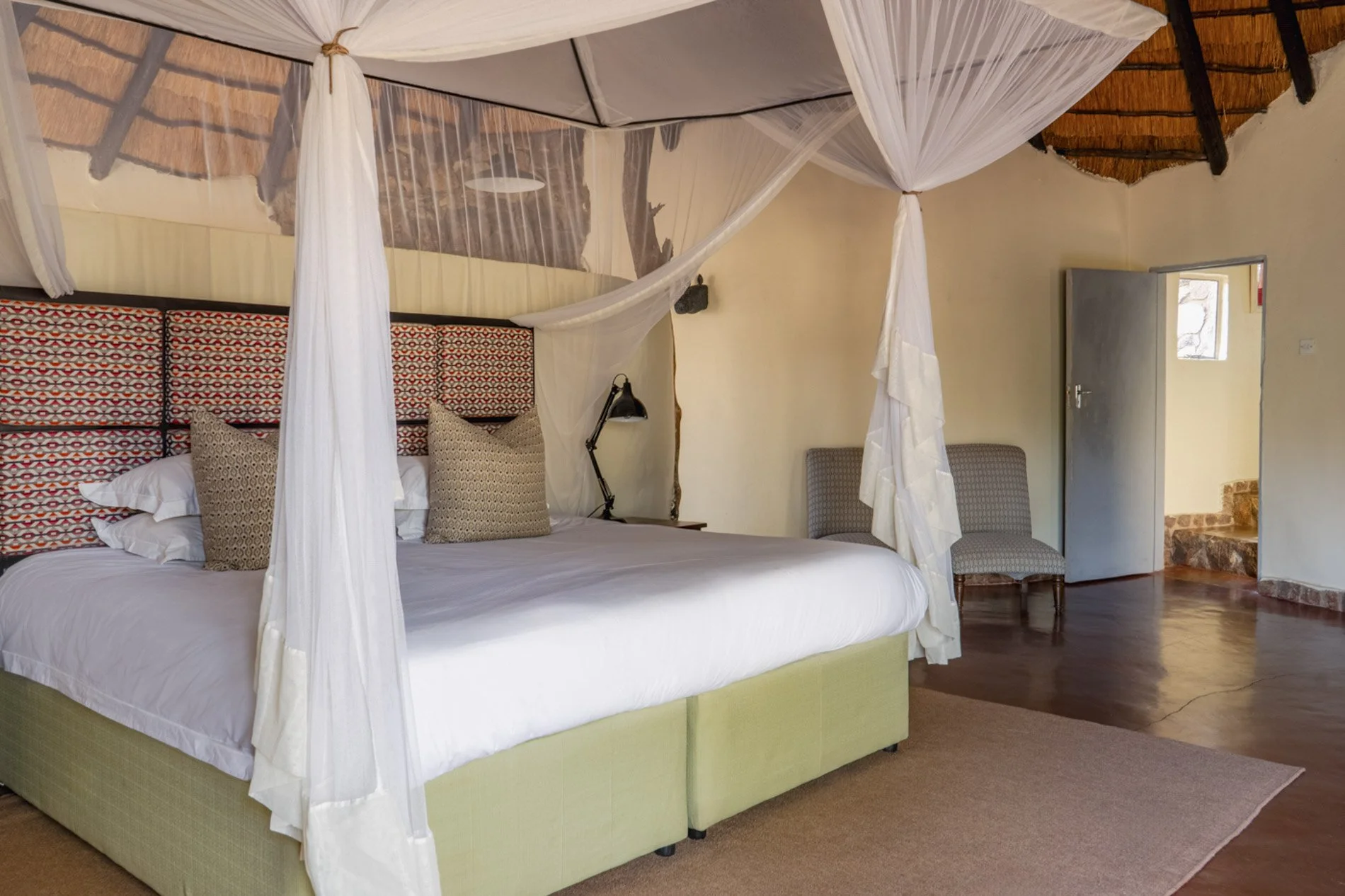 Another view of the same king bedroom at The Homestead, without the chairs