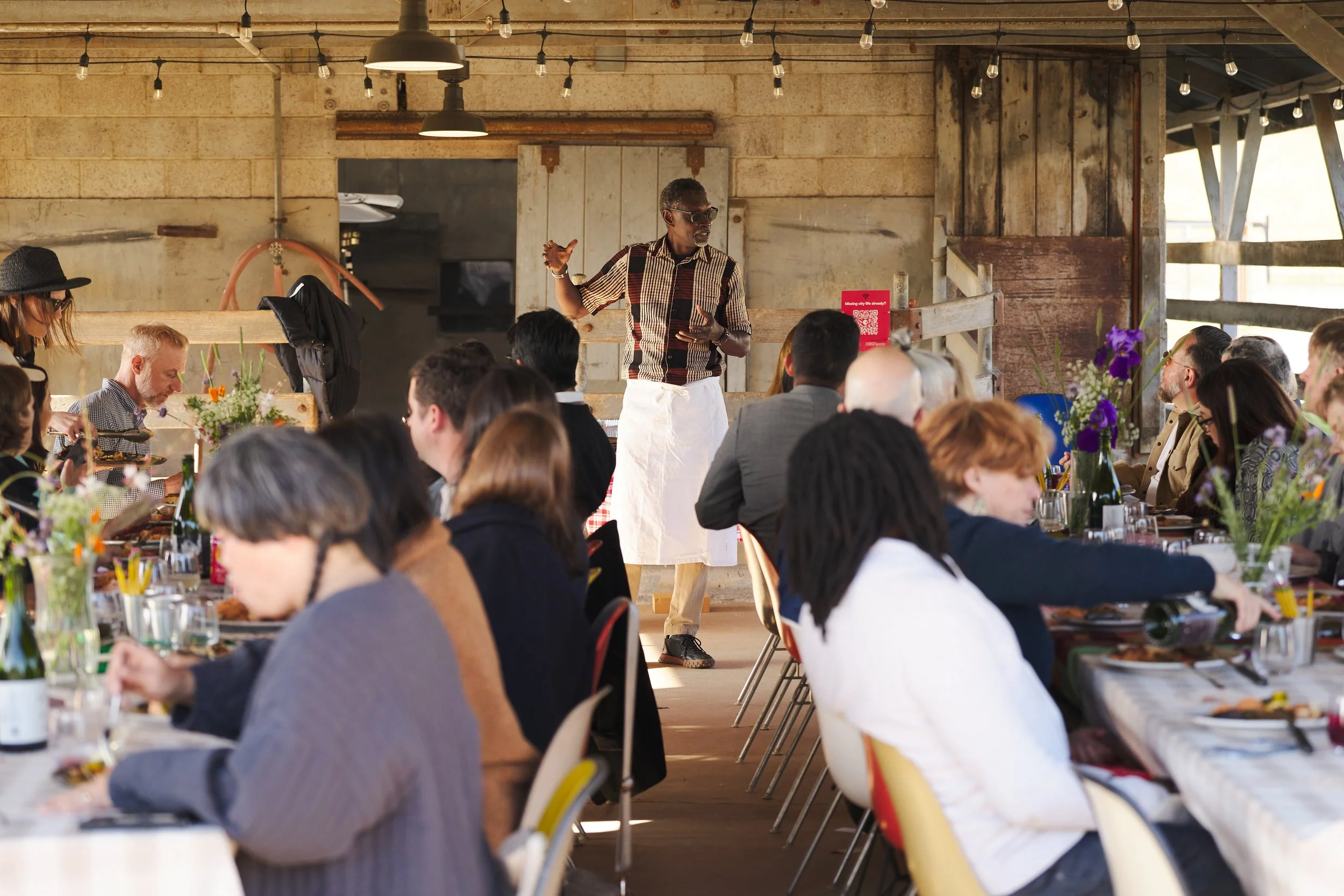 Pierre speaks to guests at a Gastrodiplomacy dinner on the Eames Ranch