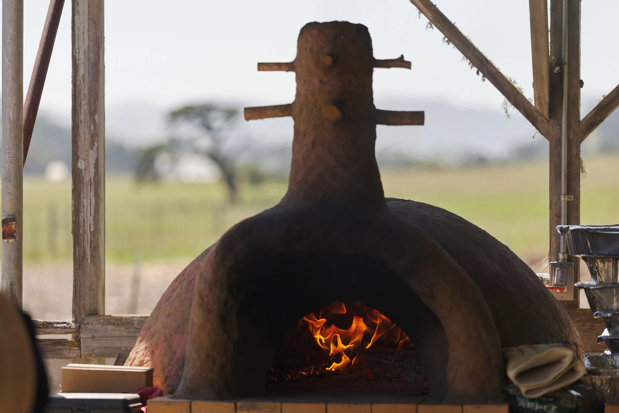 A wood fire built in a traditional African clay oven