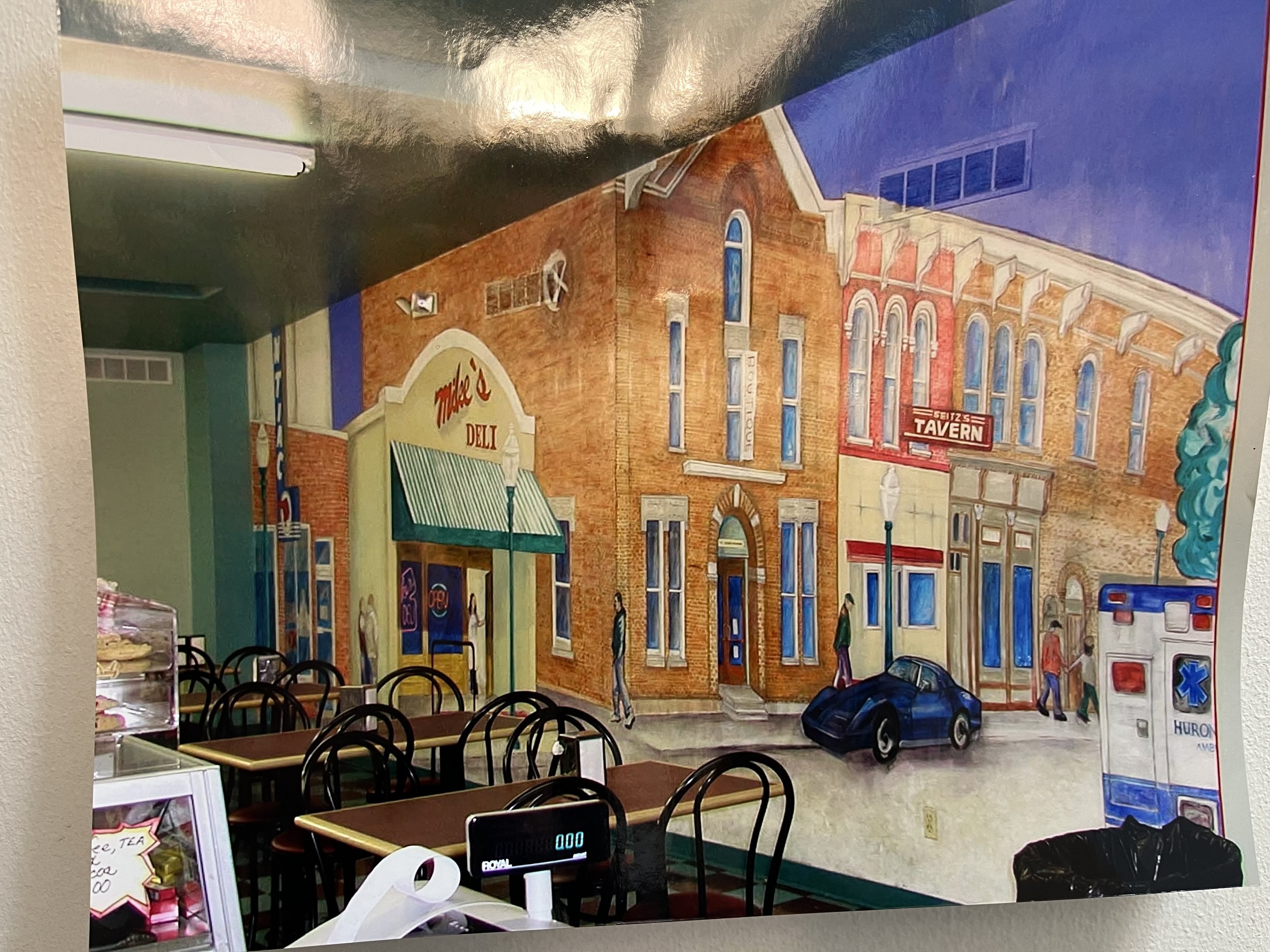 Mike's Deli, Chelsea Michigan. Mural 360 degrees. Depicts outside of the building