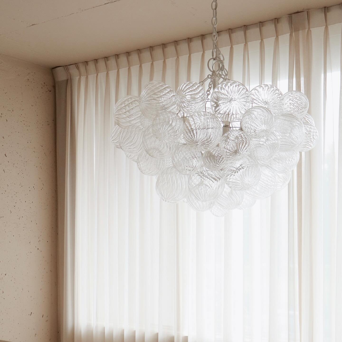 If you&rsquo;ve been into our studio, you&rsquo;ve seen the breathtaking chandelier that serves as our statement piece - a sculptural design resembling delicate molecules. This stunning fixture isn&rsquo;t just a design element; it&rsquo;s a reflecti