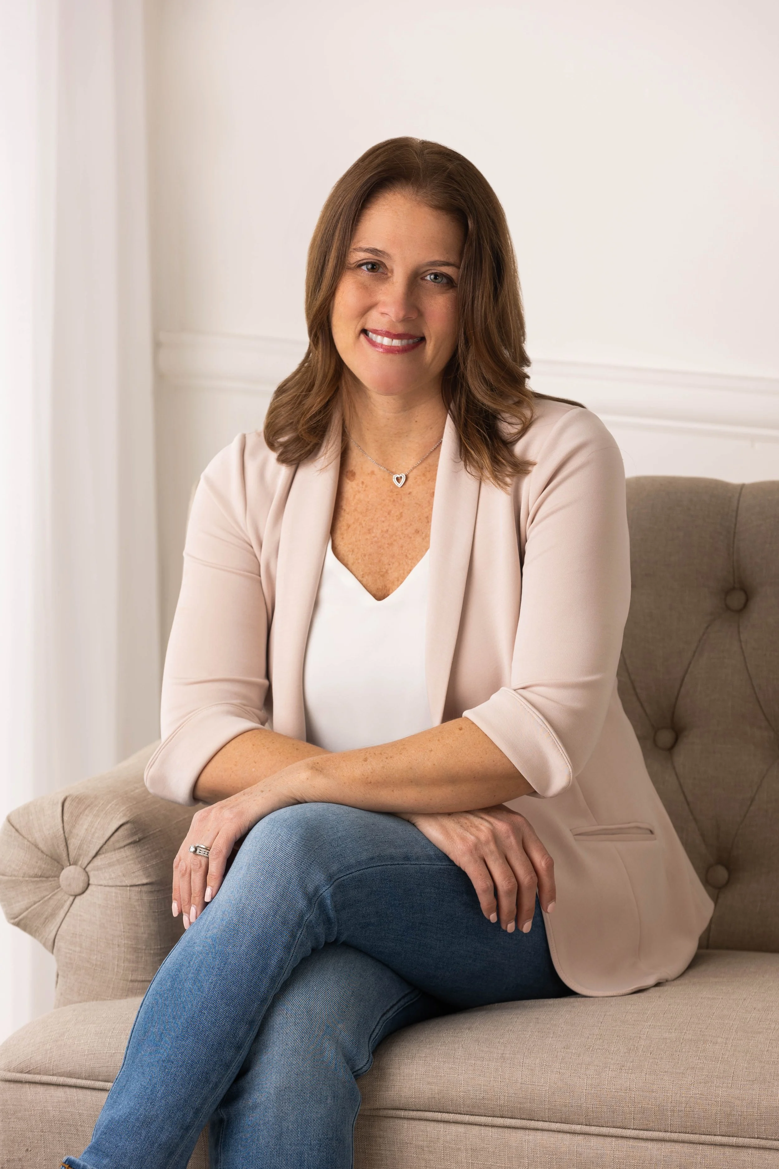 Women’s health expert explaining perimenopause symptoms like fatigue and bloating