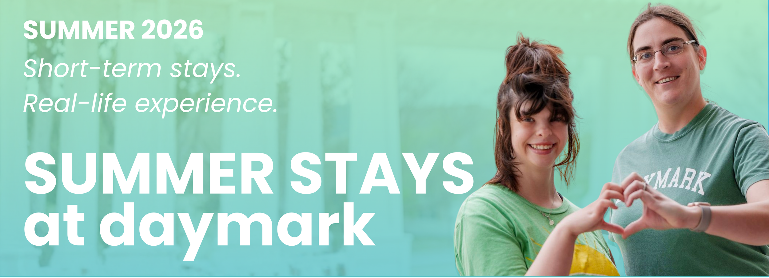 A smiling woman and man forming a heart shape with their hands, wearing casual clothing, standing outdoors with green trees in the background, promoting a summer stay at Daymark in 2026.