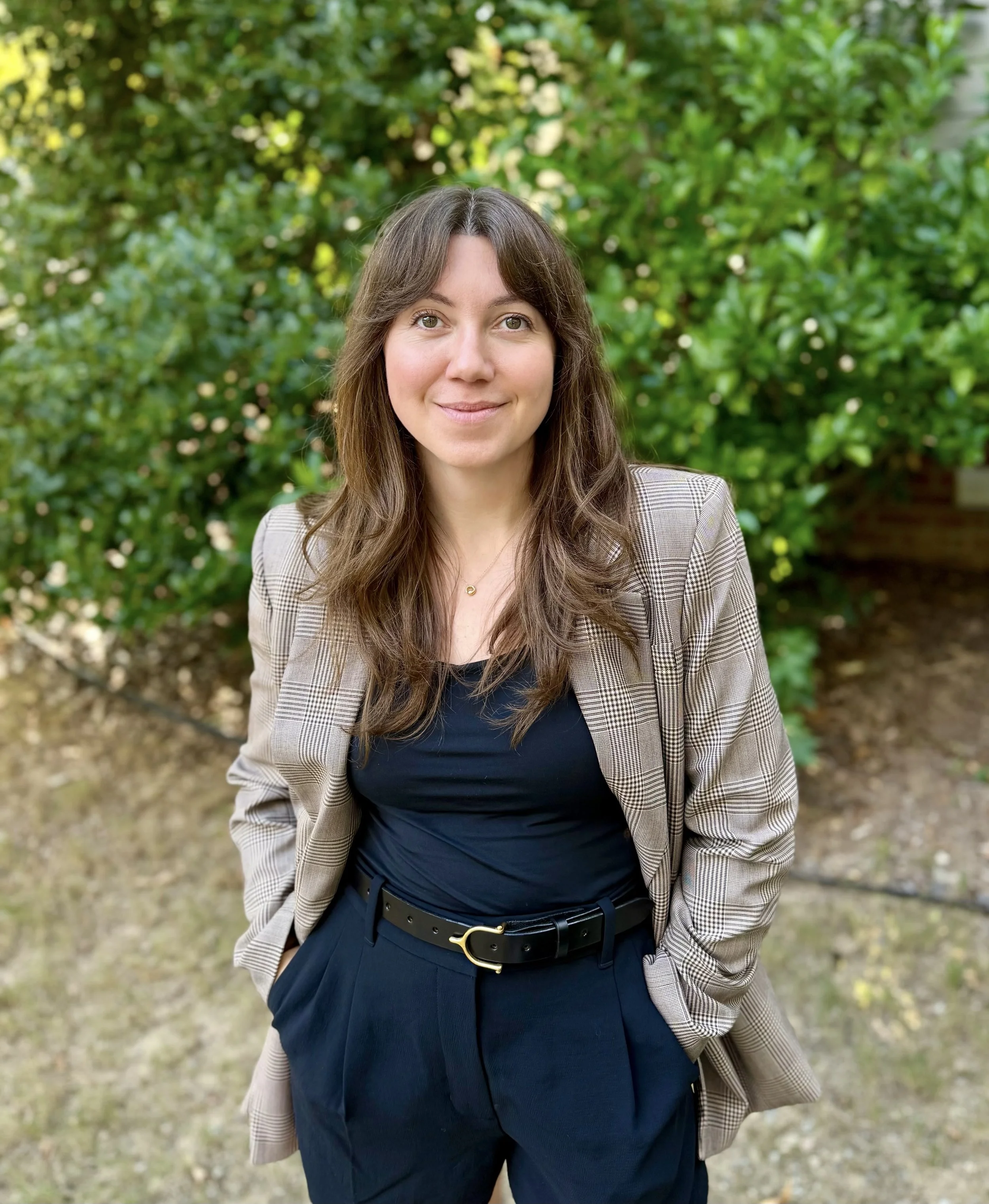 Val Kallen, registered dietitian, standing outdoors in front of greenery