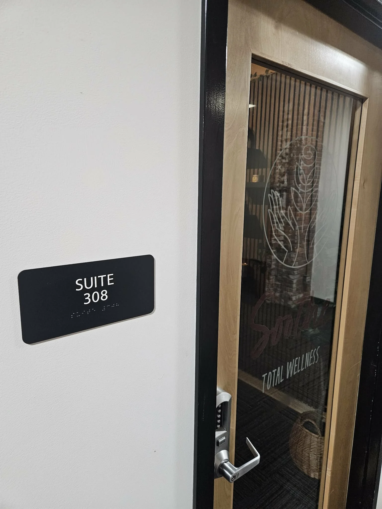Soothe Total Wellness's front door showing clients they are located in suite 308