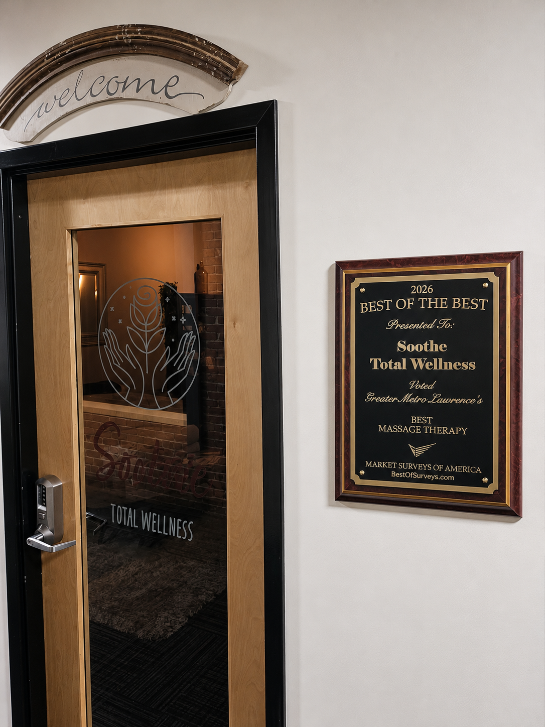Entrance to Soothe Total Wellness with a plaque next to it awarding them "Best Massage Therapy" 