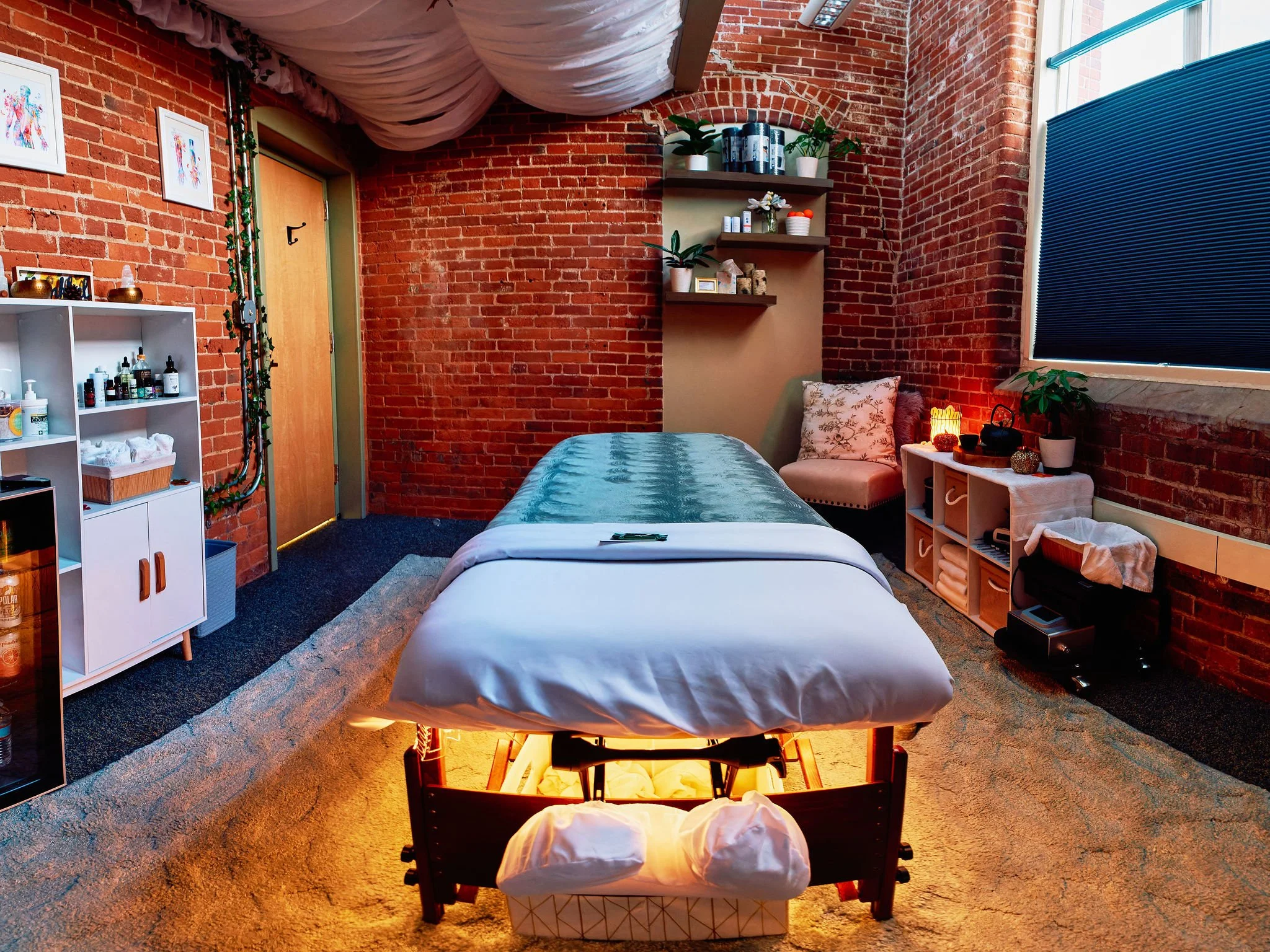 Calming, tranquil massage table inviting it next client to its soft, warm habitat to be whisked away to blissful relaxation.