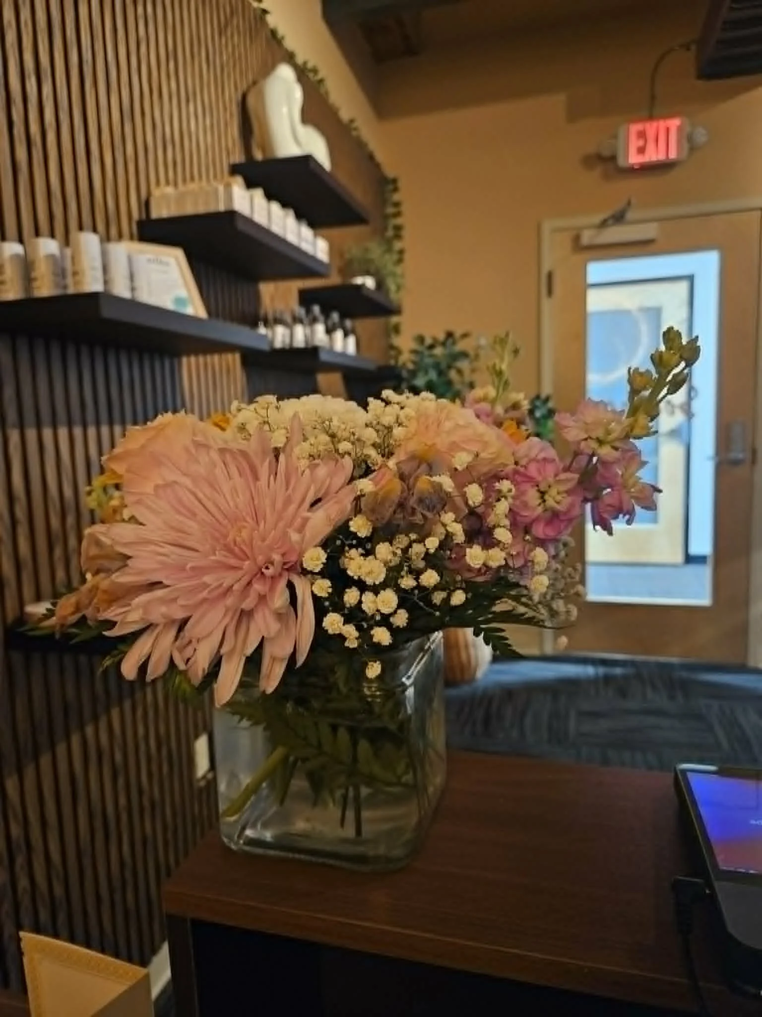 Fresh flowers giving off a wonderful aroma filling the reception area at Soothe Total Wellness with a touch of sweet fragrance.