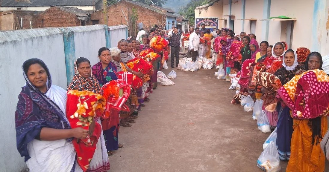 Group of woment receiving food and blankets in South Asia.jpeg