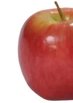 Close-up of a red apple with a small greenish-yellow spot and a short stem.