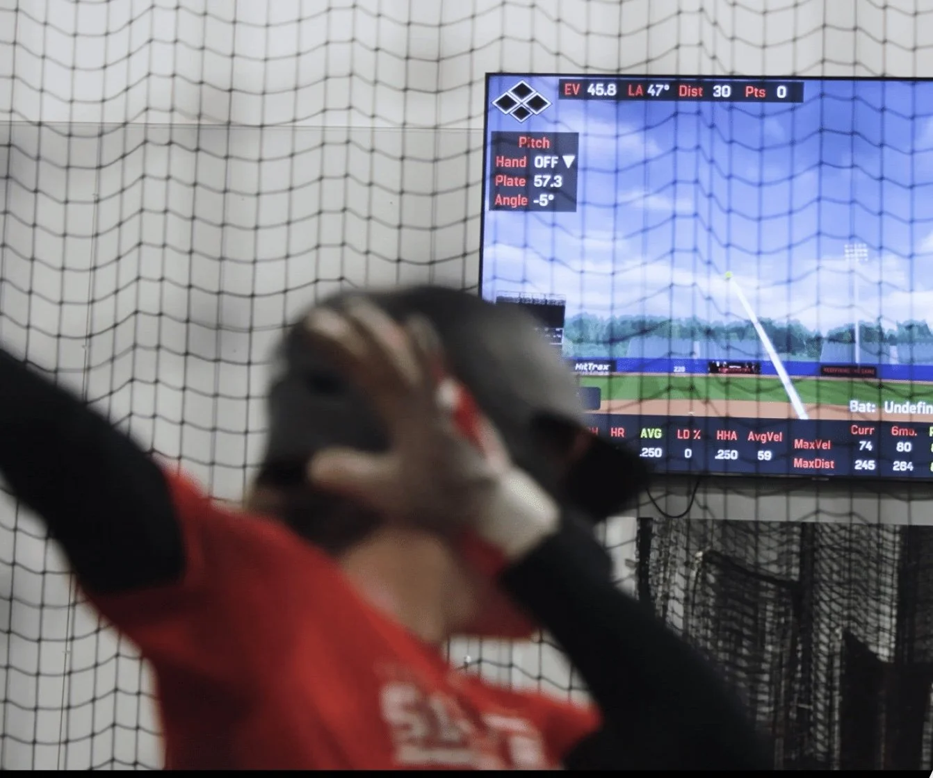 Baseball player in WIG’s HitTrax batting cage