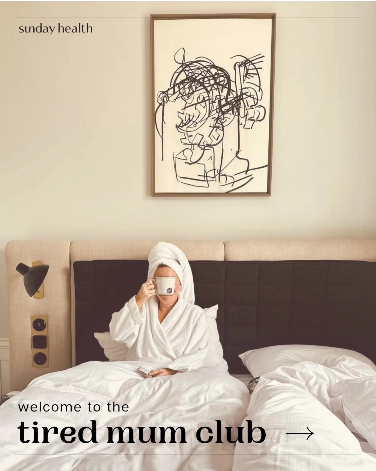 A woman in a bathrobe with a towel wrapped around her head, sitting on a bed and drinking from a cup in a hotel room. There is a modern artwork hanging above the bed and the text on the image reads 'welcome to the tired mum club' and 'sunday health'.