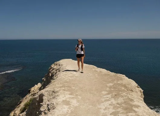 Woman Hiking on coastal trail in Adelaide