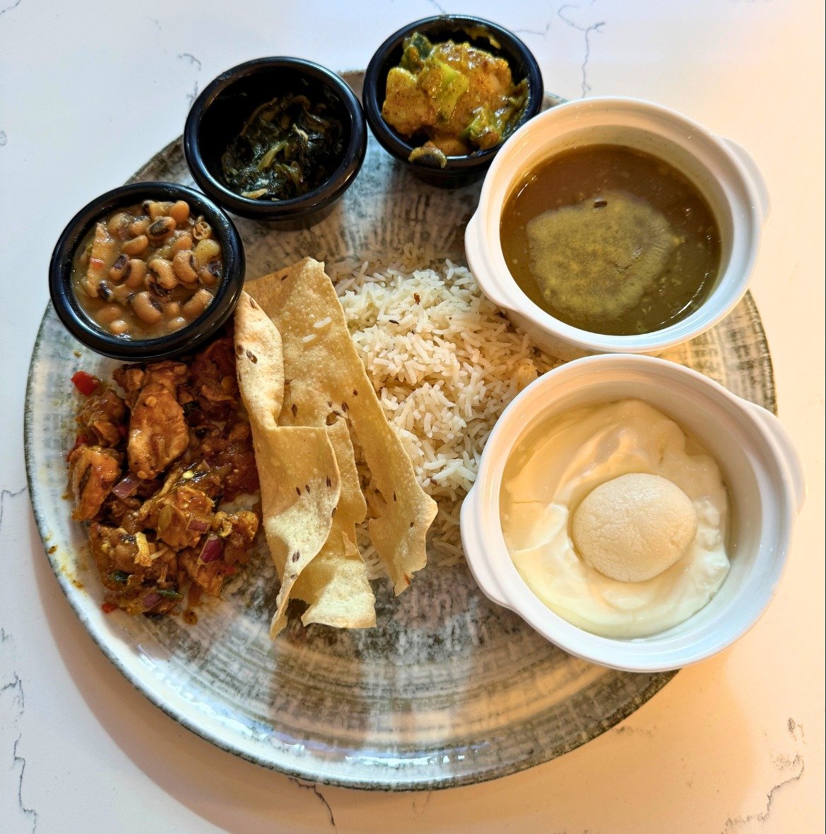 Transport yourself to Nepal with our incredible new special! 🌟 Introducing Sarita's Thakali Set, &quot;Taste of Nepal,&quot; for just $26. This authentic feast includes marinated chicken taas, fragrant cumin rice, spiced saut&eacute;ed spinach, pota