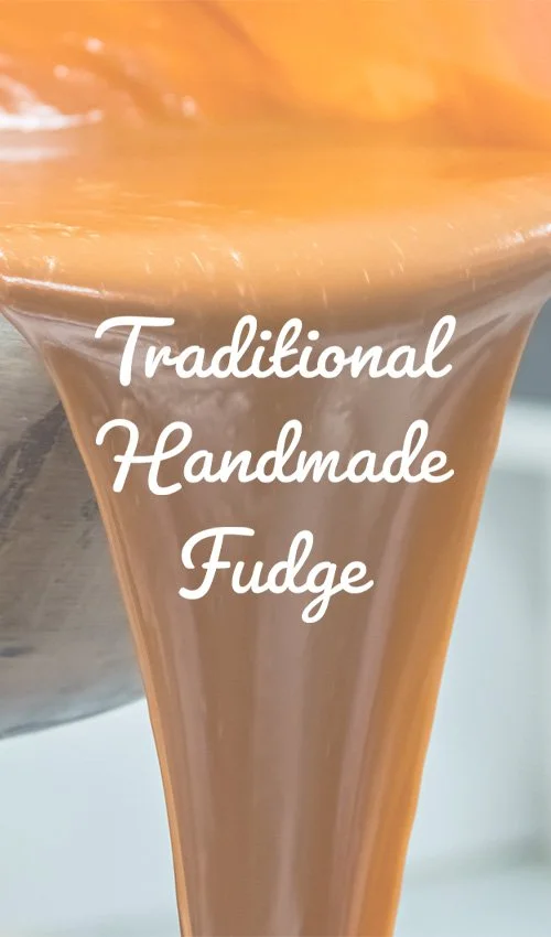 Close-up of traditional handmade fudge being poured from a copper pot, with the words 'Traditional Handmade Fudge' overlaid.