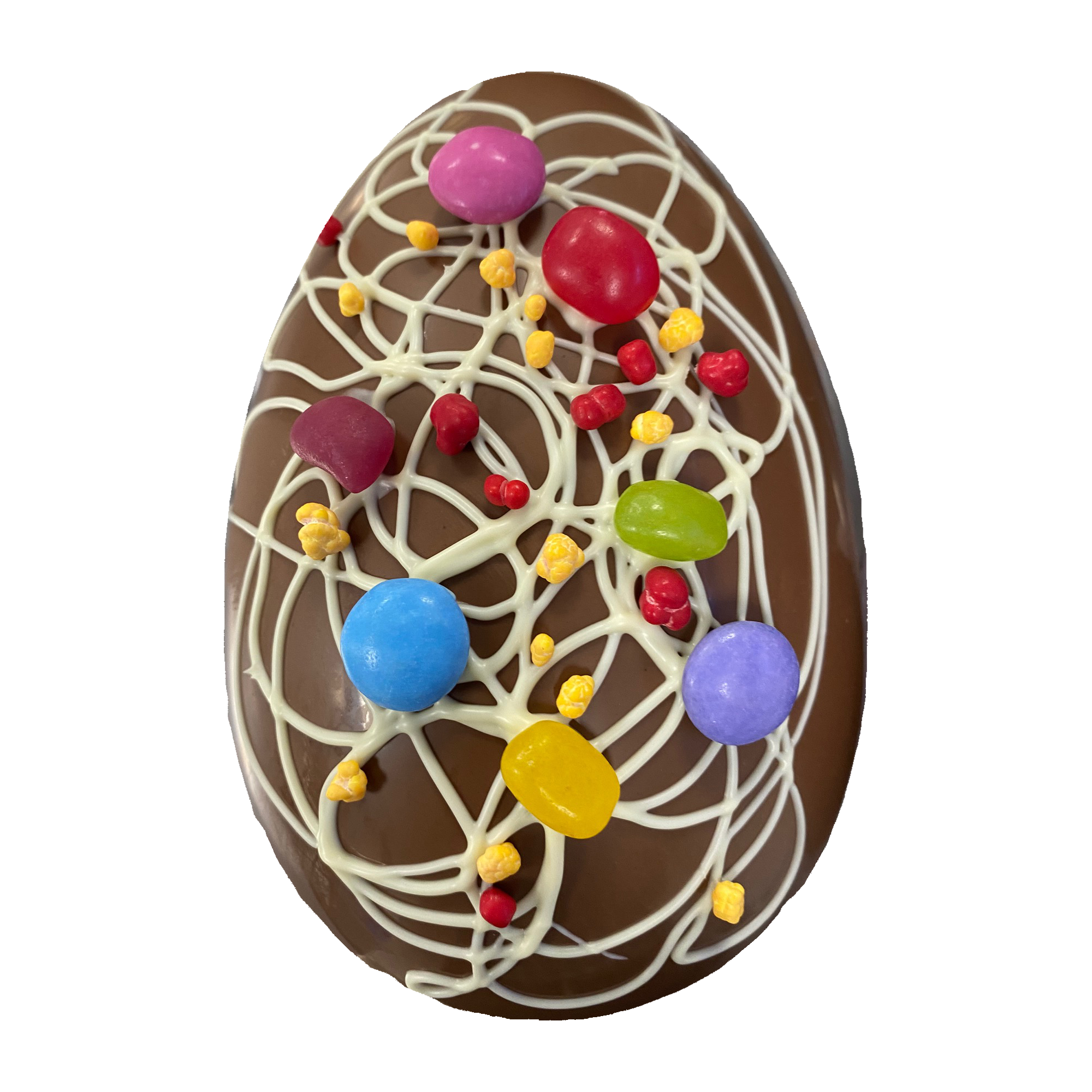 Decorated chocolate Easter egg with colorful sweets and white drizzle.