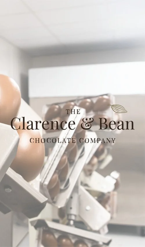 Close-up of chocolate easter eggs in a manufacturing facility with the text 'Delivering Quality Handcrafted Chocolate' overlaid.