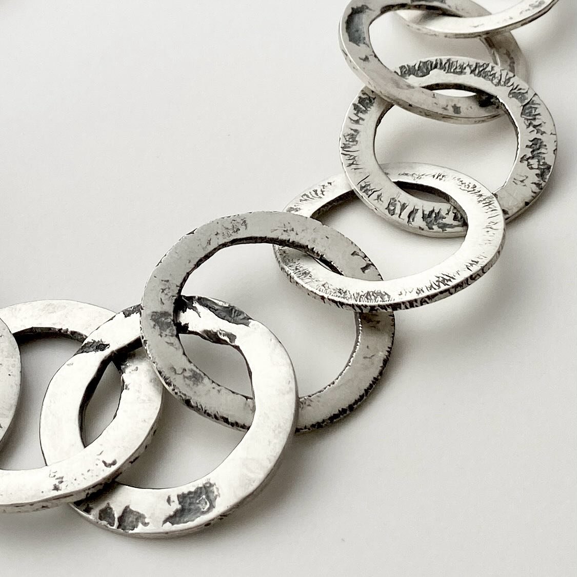 Eroded Washer Necklace, inspired by the rusty steel objects I&rsquo;ve been collecting as I walk around London.
Each &lsquo;washer&rsquo; is made with recycled silver, melted down into a nugget, rolled through the rolling mill, formed into a flat rin