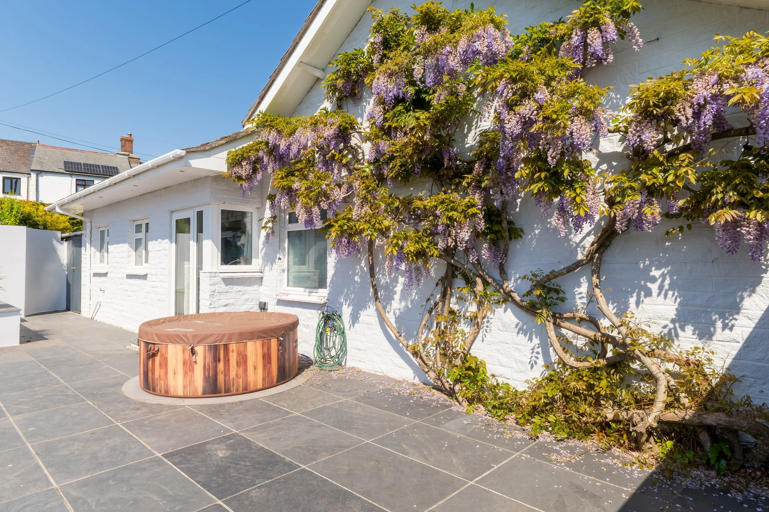 The Annex's private garden with a hot tub