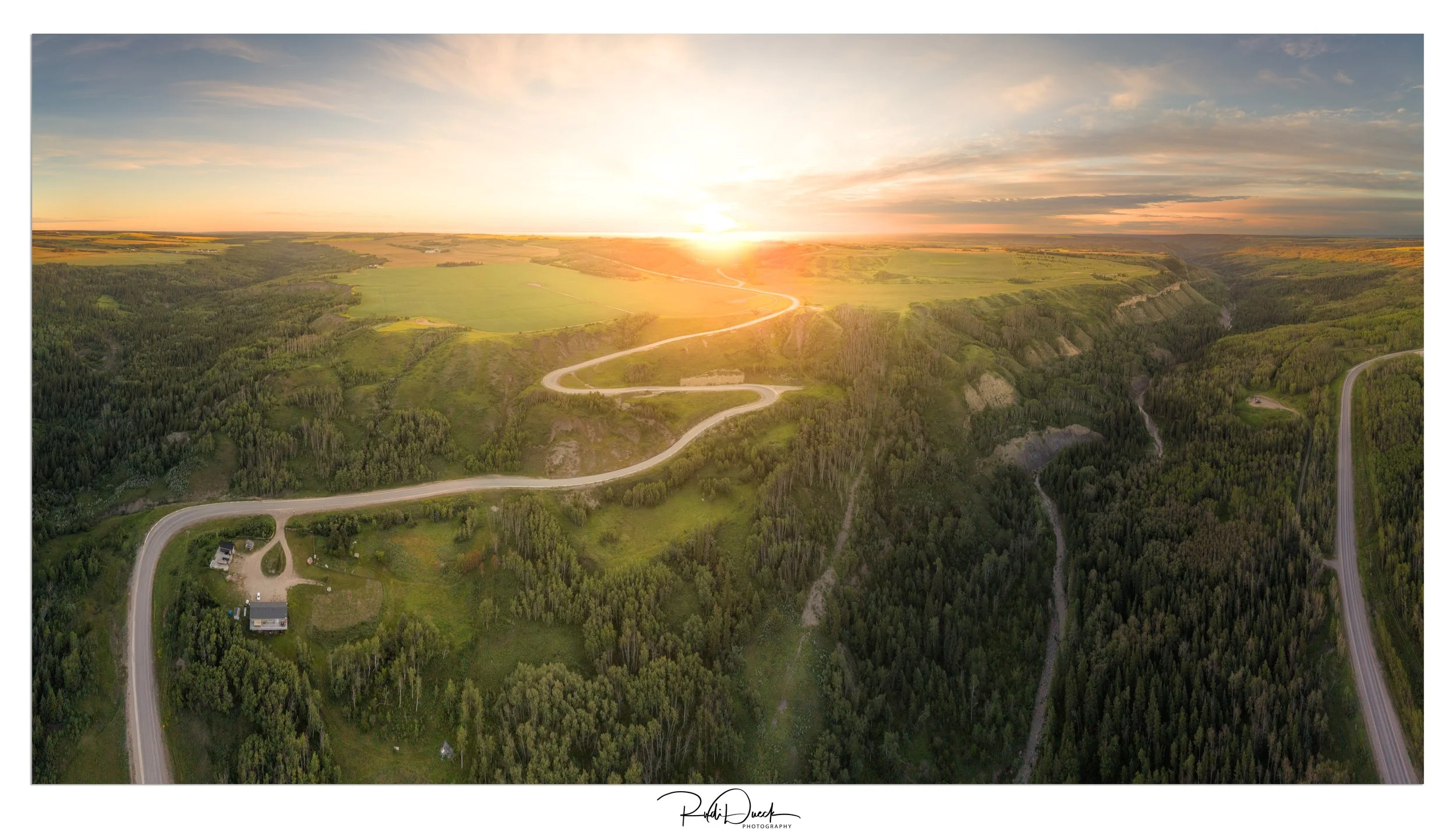 Sunrise over Pineview Lookout, just north of Fort St. John, BC. An early morning drone view showcasing the winding roads and stunning Peace River Valley bathed in golden light.

#FortStJohn #BritishColumbia #PineviewLookout #RosePrairieRoad #Sunrise 