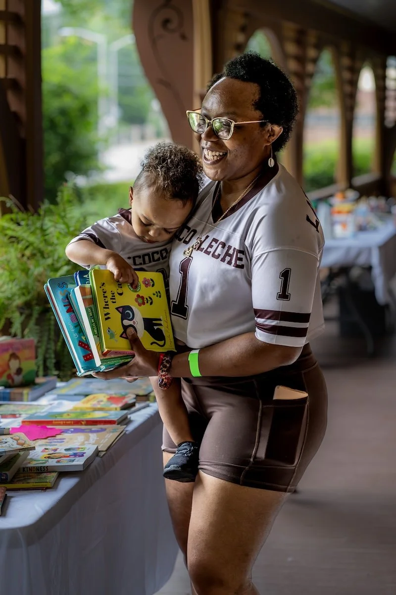 Mom and baby with books.jpg