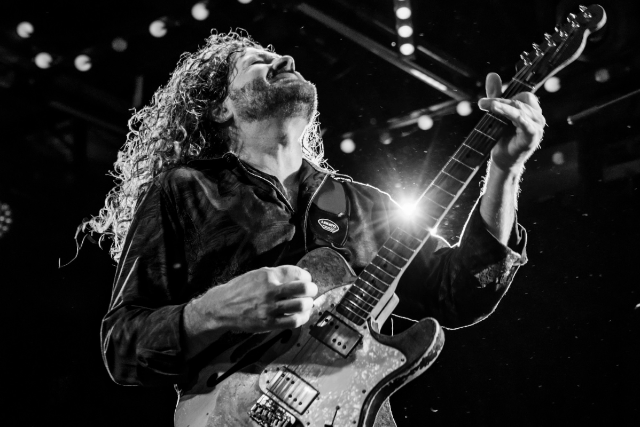 Tab Benoit playing guitar