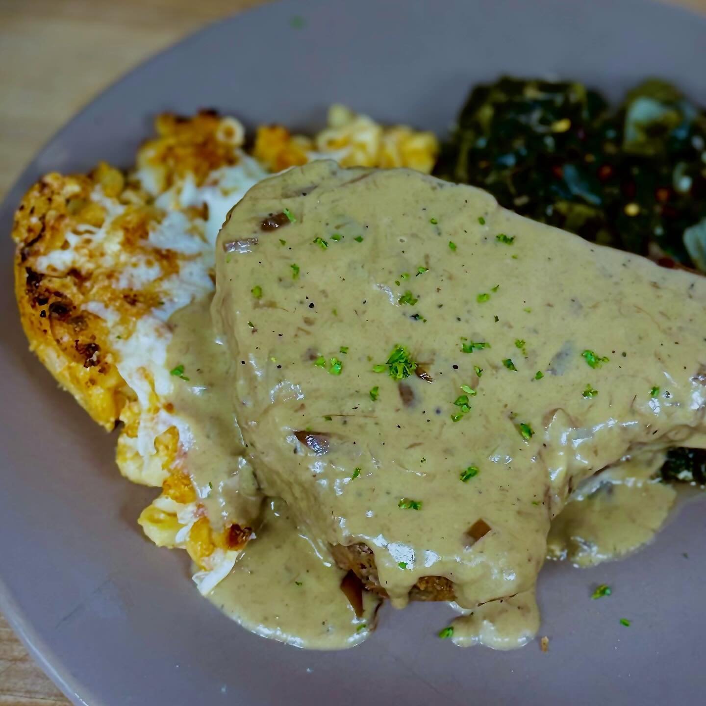 SPECIAL TONIGHT 🔥🔥 Goodness&mdash;Gracious! We&rsquo;ve got your Fried Porterhouse Pork Chop topped with French Onion gravy and served with Macaroni Pie + Turnip Greens. 🔥🔥