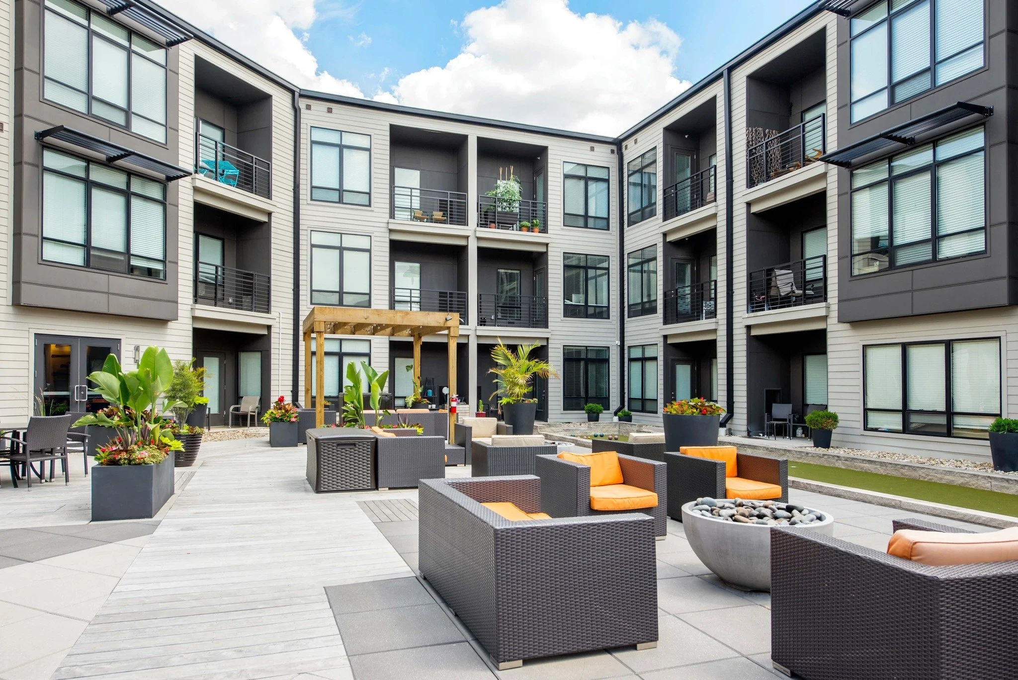 Unwind after work in our outdoor courtyard&mdash;cheers to sunset hour.