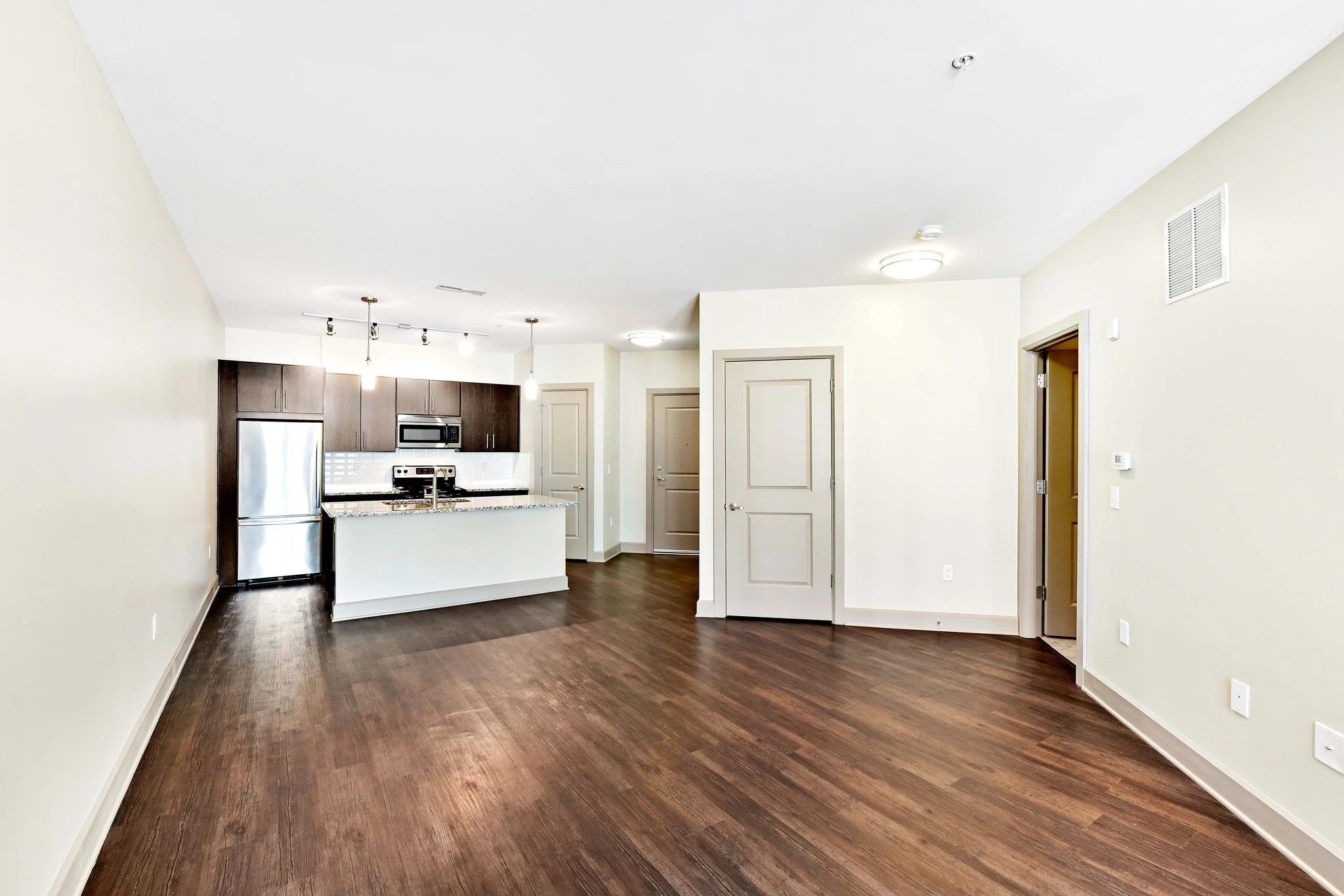 City style from the moment you walk in: floor-to-ceiling windows, open kitchens, and sleek finishes.