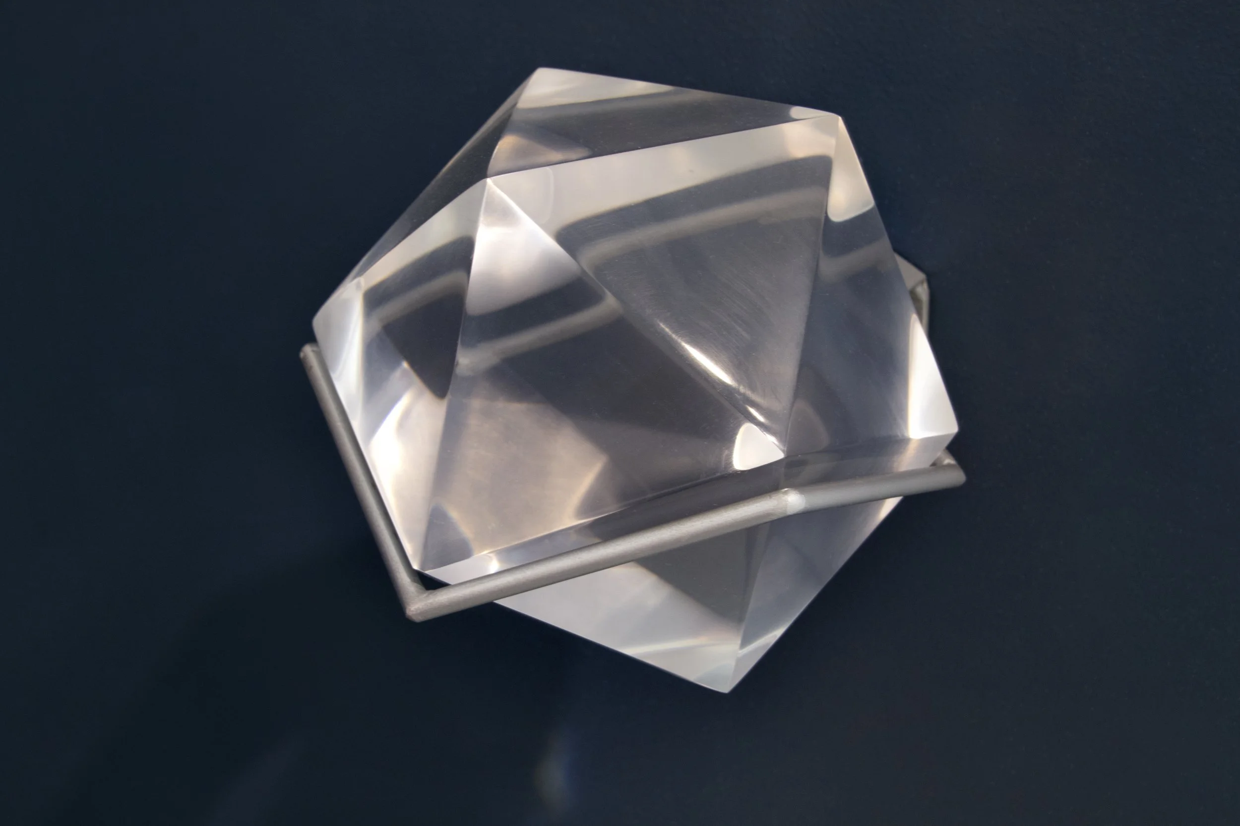 Affirmation of Life - Water, 2019. Clear cast Urethane, painted steel mount. 6" icosahedron
