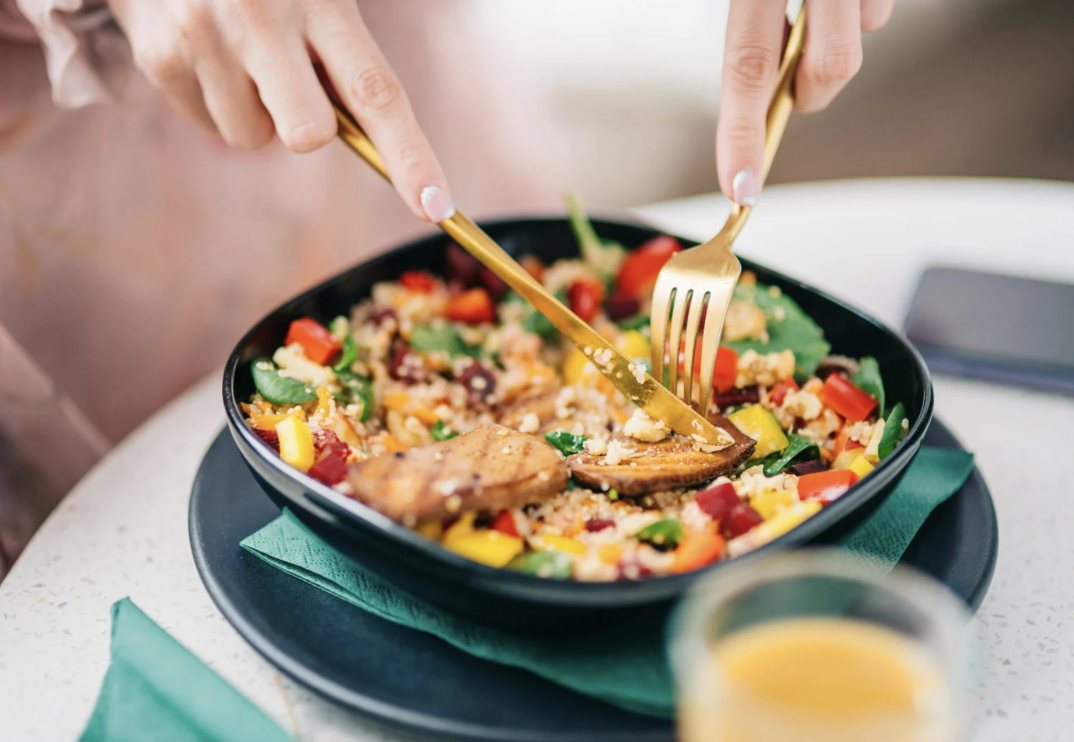Cutting up a bowl of food