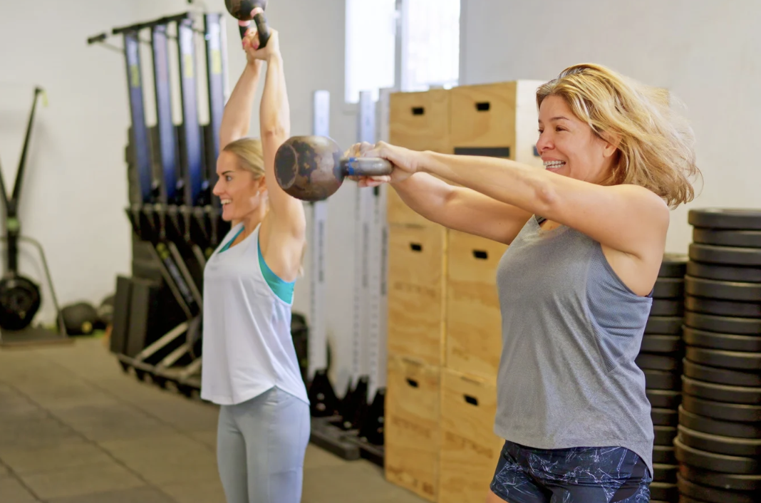 Woman swinging kettlebell