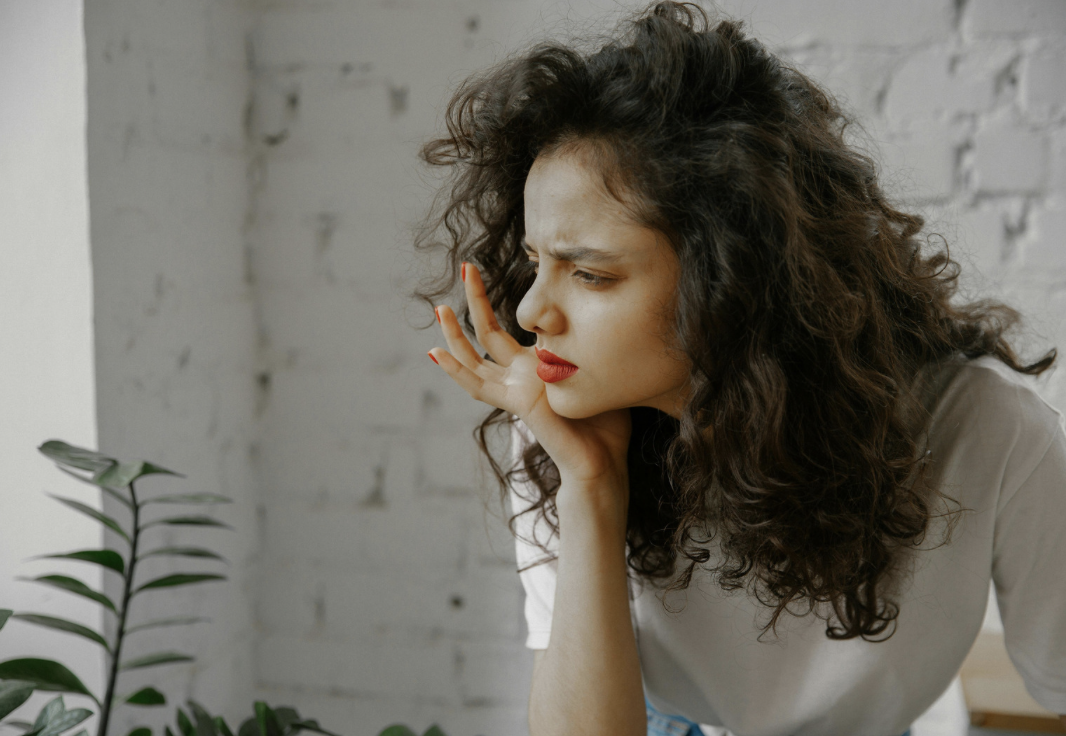 woman looking sideways with confused expression