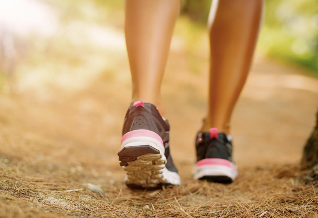 close up back of woman's sneakers walking