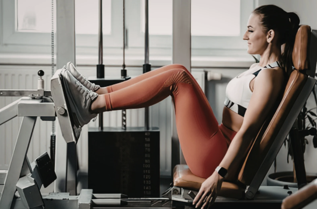 Woman working out on leg machine