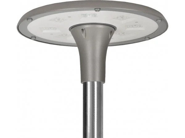A modern streetlamp with a circular LED light fixture mounted on a metallic pole.