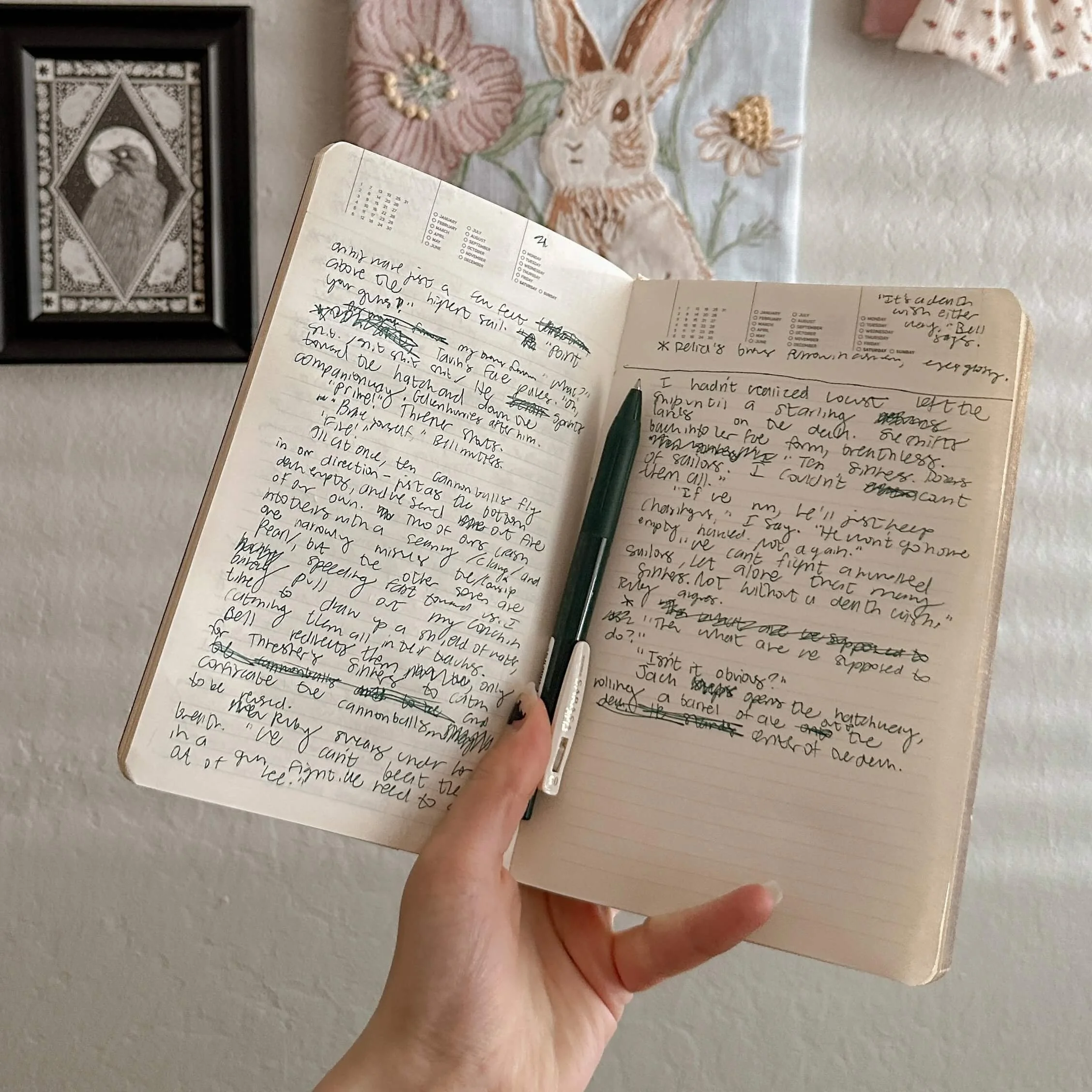 An author holding up a notebook filled with handwriting, showing the concept of writing a book or novel