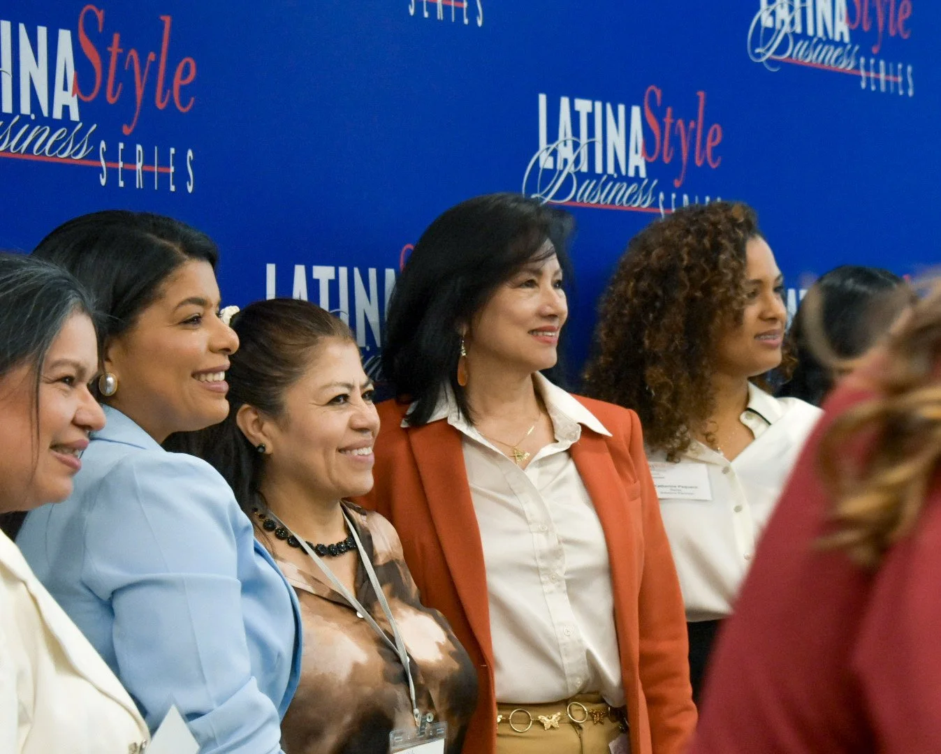 Maria C. Garza, keynote speaker, taking photos with attendees.jpg