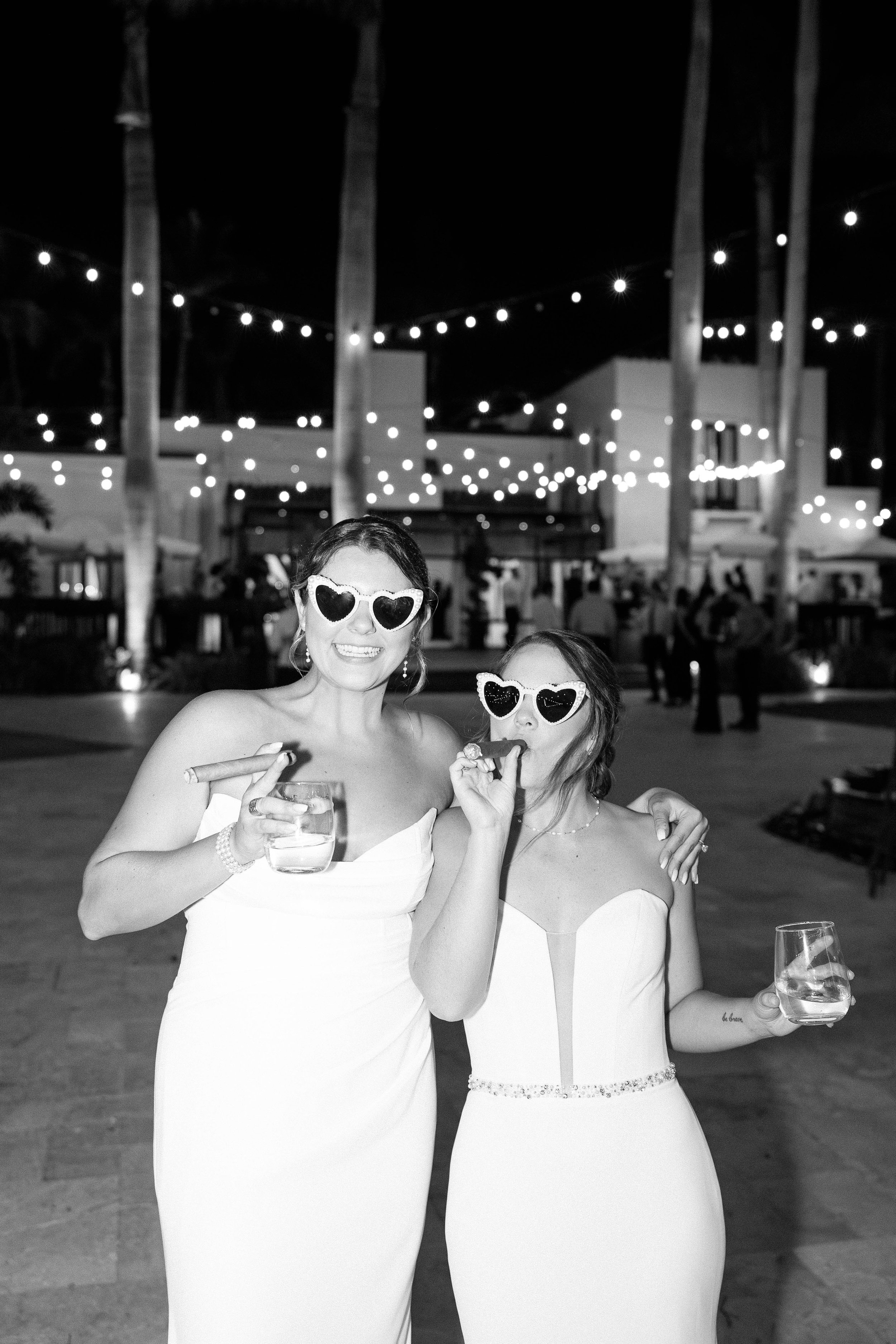 Brides smoking cigars at the Alderman House by Mizner by wedding photographer Fort Myers