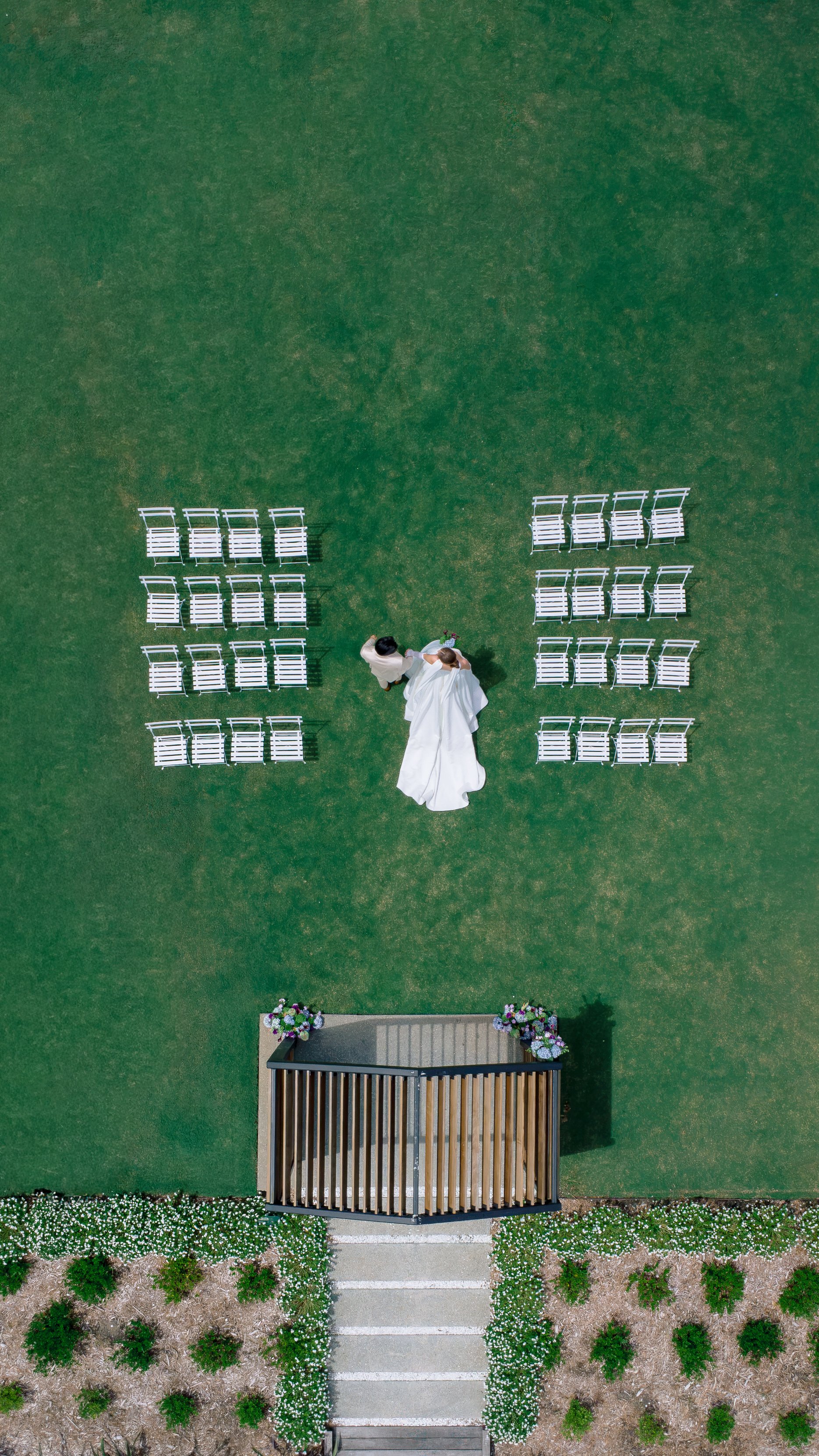Drone photography of bride and groom at ceremony site by Lakeland wedding photographer