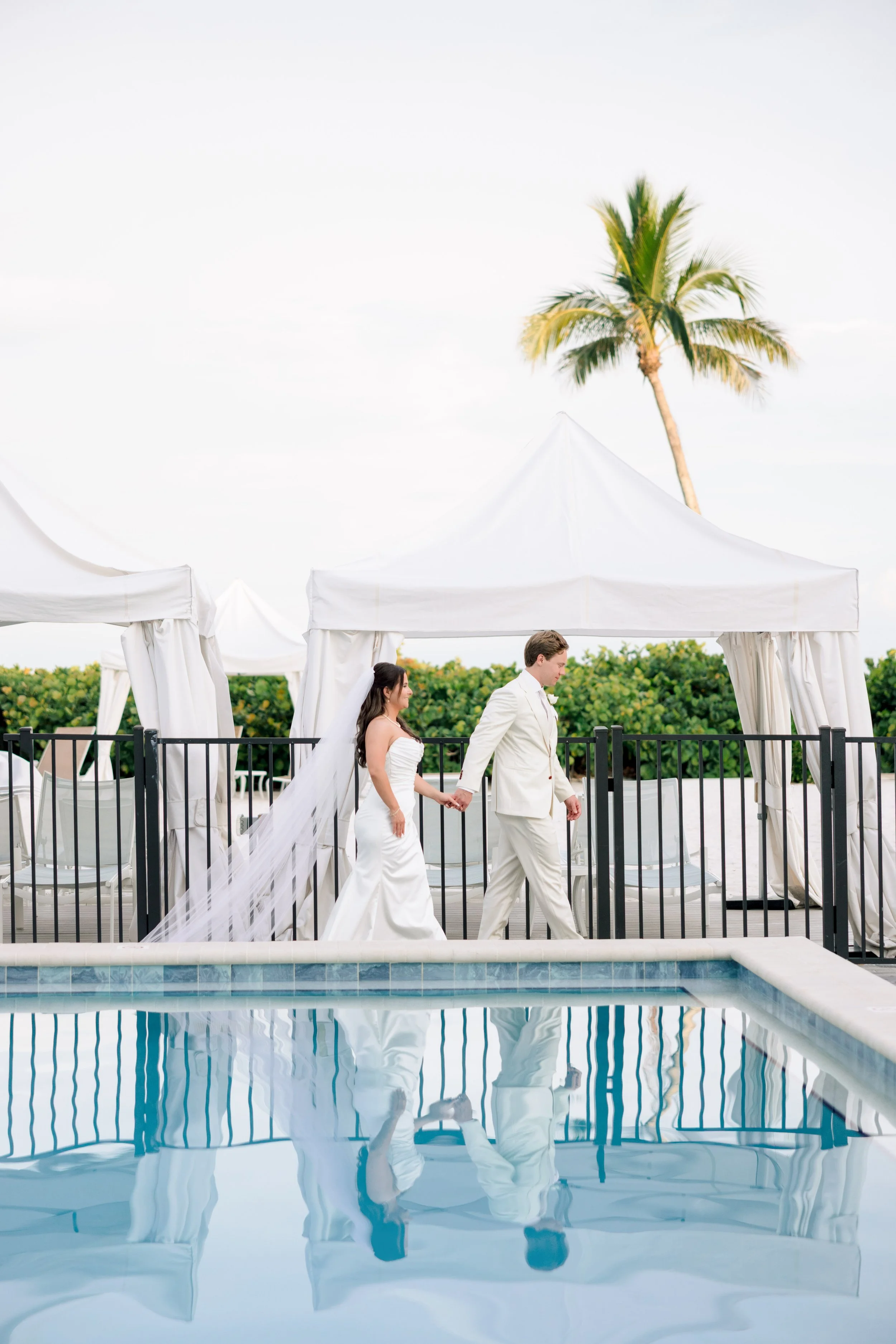 Bride and groom by the pool at Sundial resort by Sanibel wedding photographer