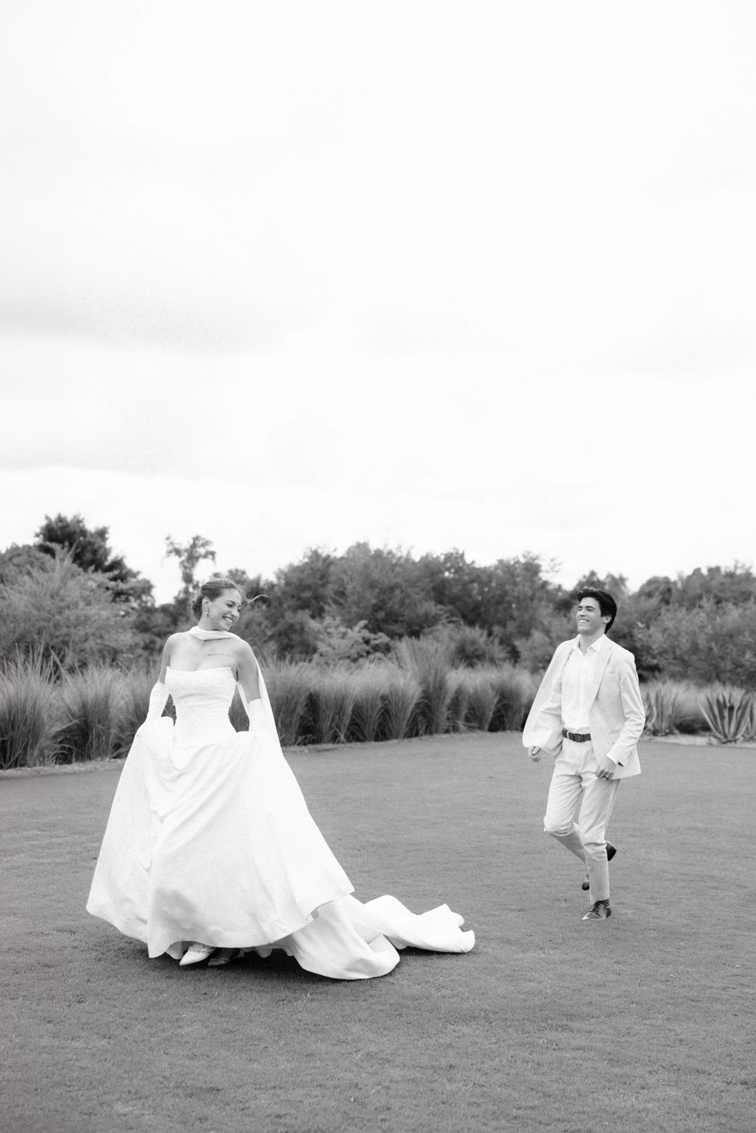 Photo of bride and groom running by Orlando wedding photographer