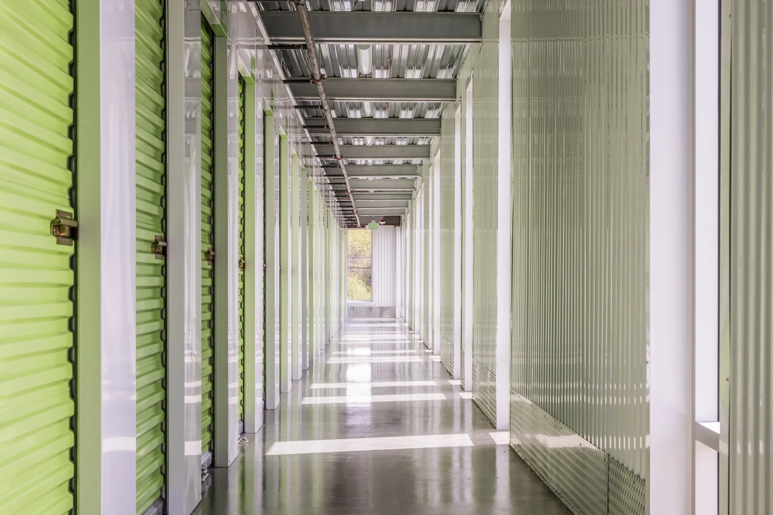 Self-storage hallway with daylight at the far end, P82, Portland, Oregon