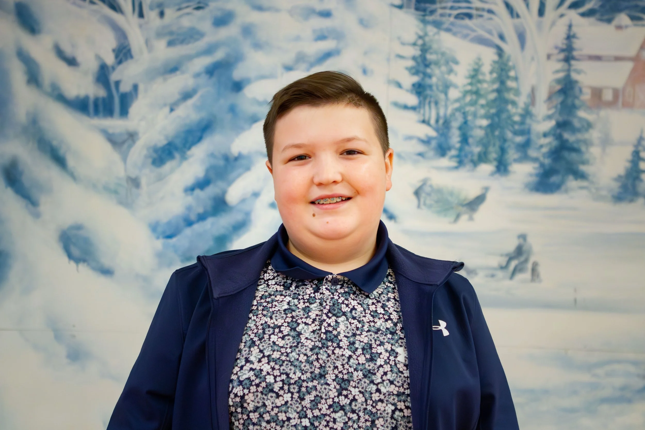 Headshot of Carson Feger, who plays Charlie Brown in the red cast.