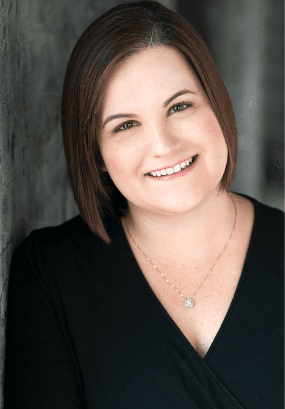 Catie Brown faces the camera, smiling. 