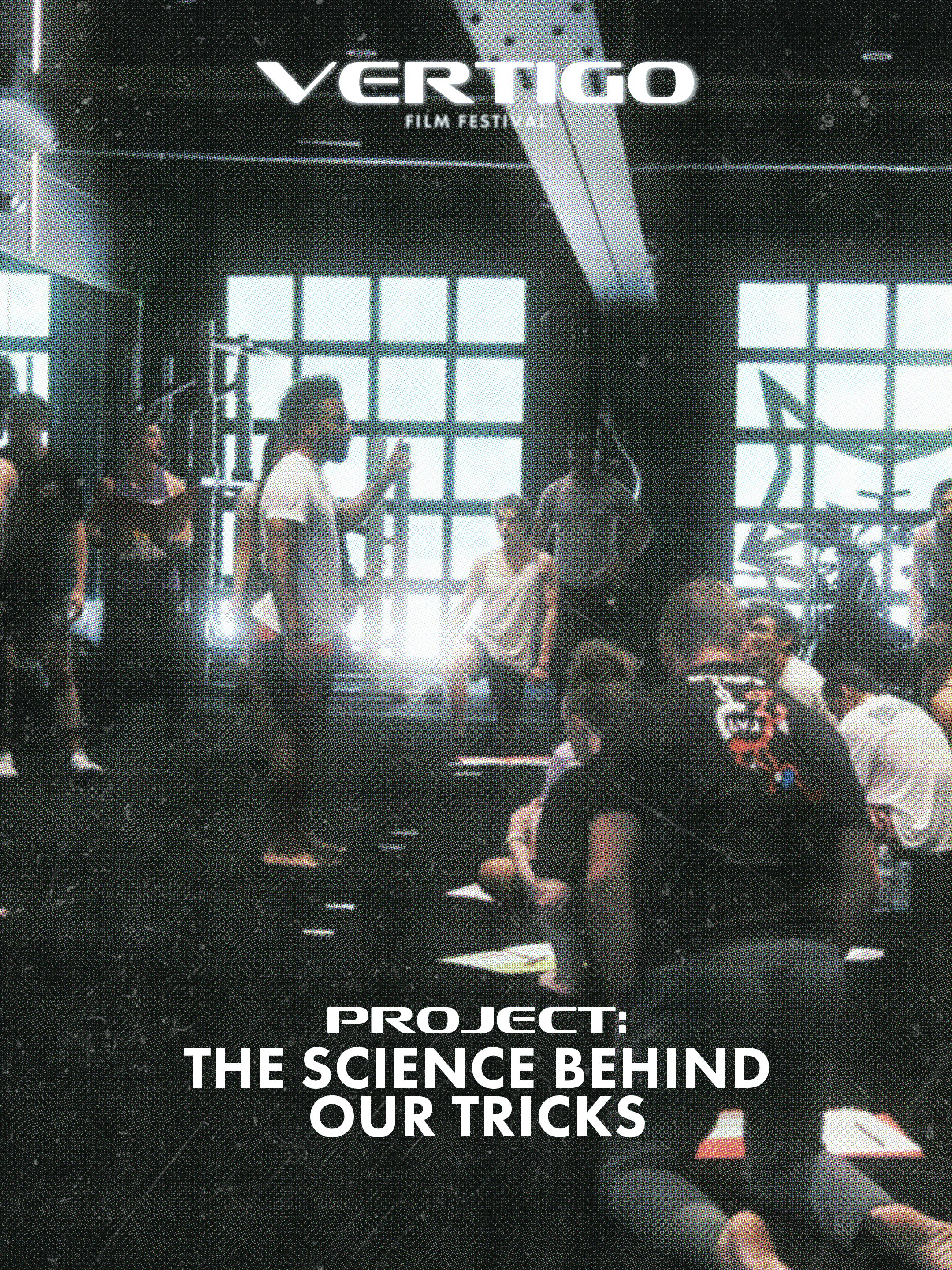 People in a dark room with large windows and bright lights, some sitting and some standing, with the text 'Vértigo Film Festival' at the top and 'Project: The Science Behind Our Tricks' at the bottom.