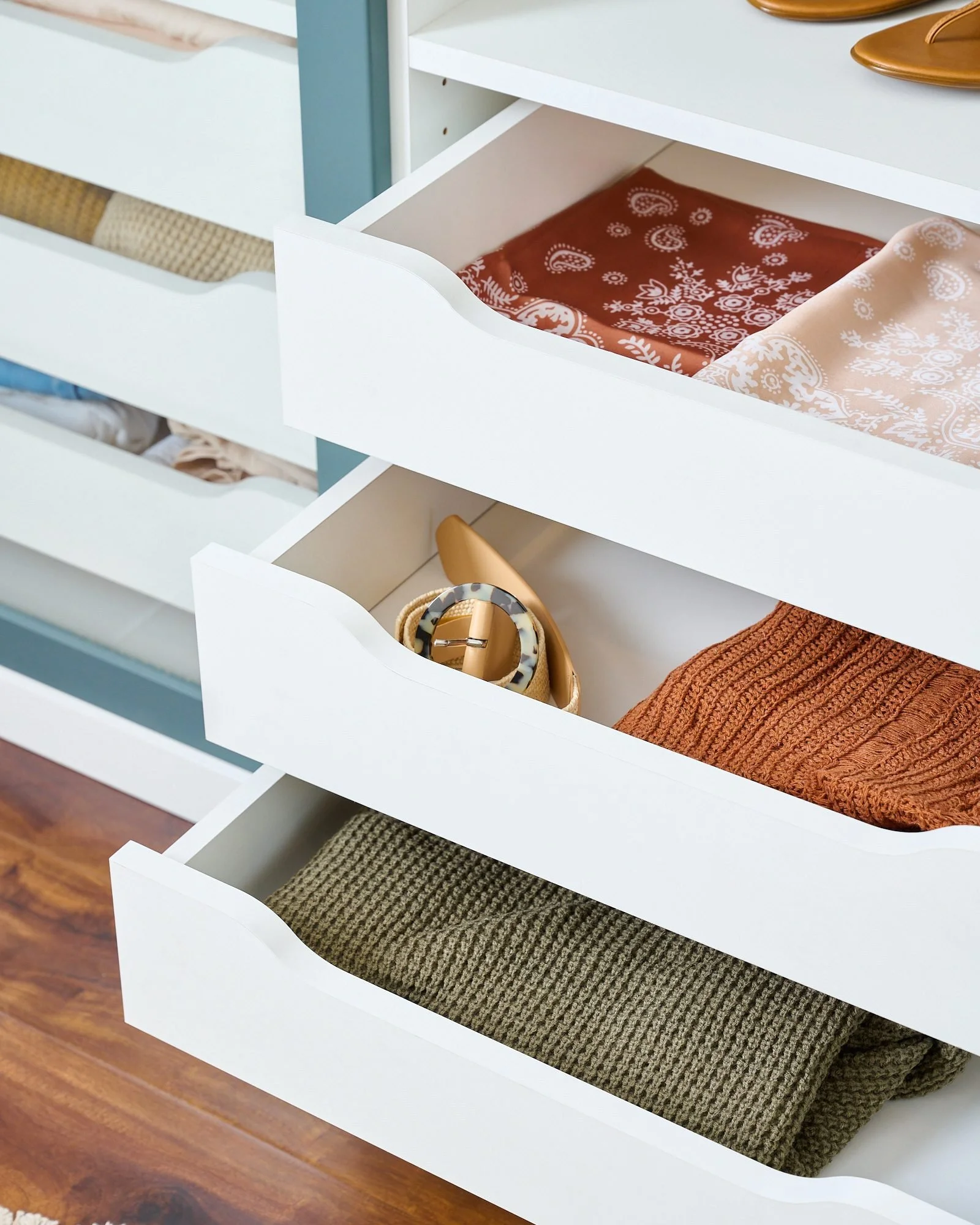 Lagoon-and-White-Closet-Scoop-Drawers-Behind-Doors-Crop-July-2022.jpg