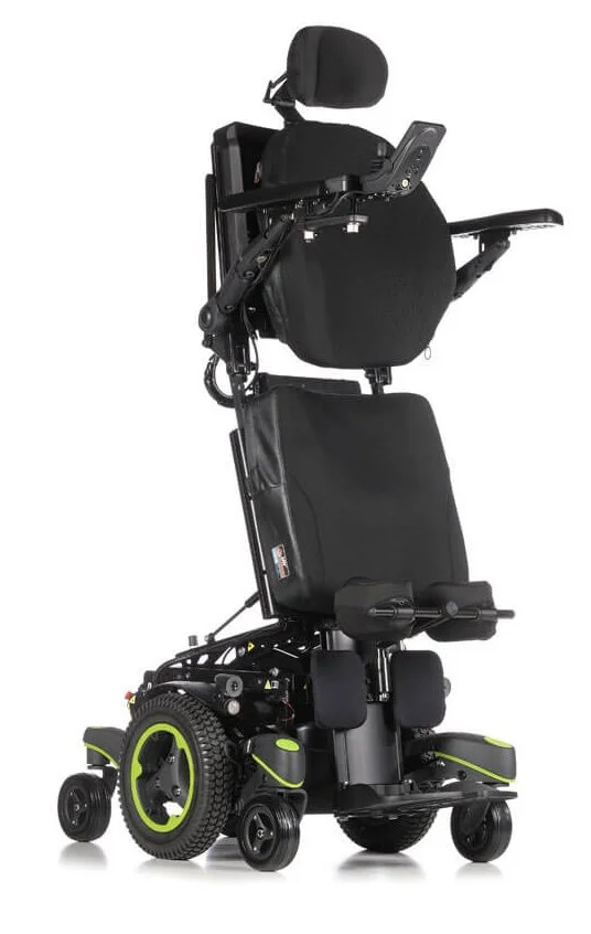 Electric wheelchair with standing feature, black with green accents, headrest, and armrests.
